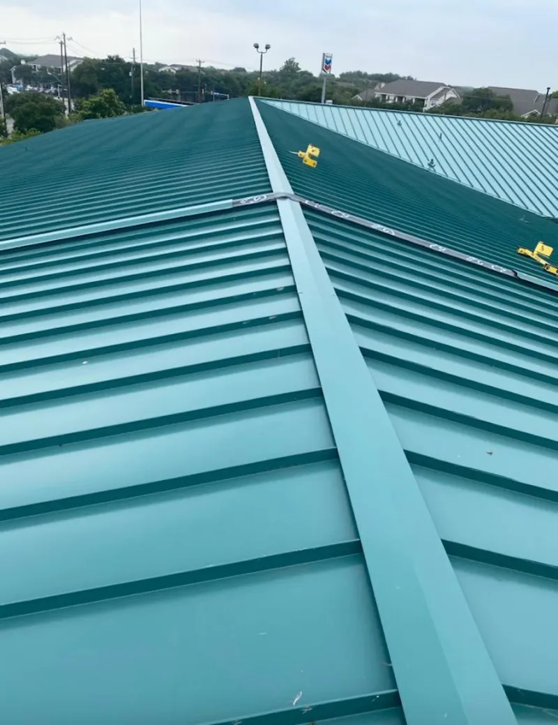 Green commercial metal roof ridge and valley for Metal Roof Repair in Glenwood